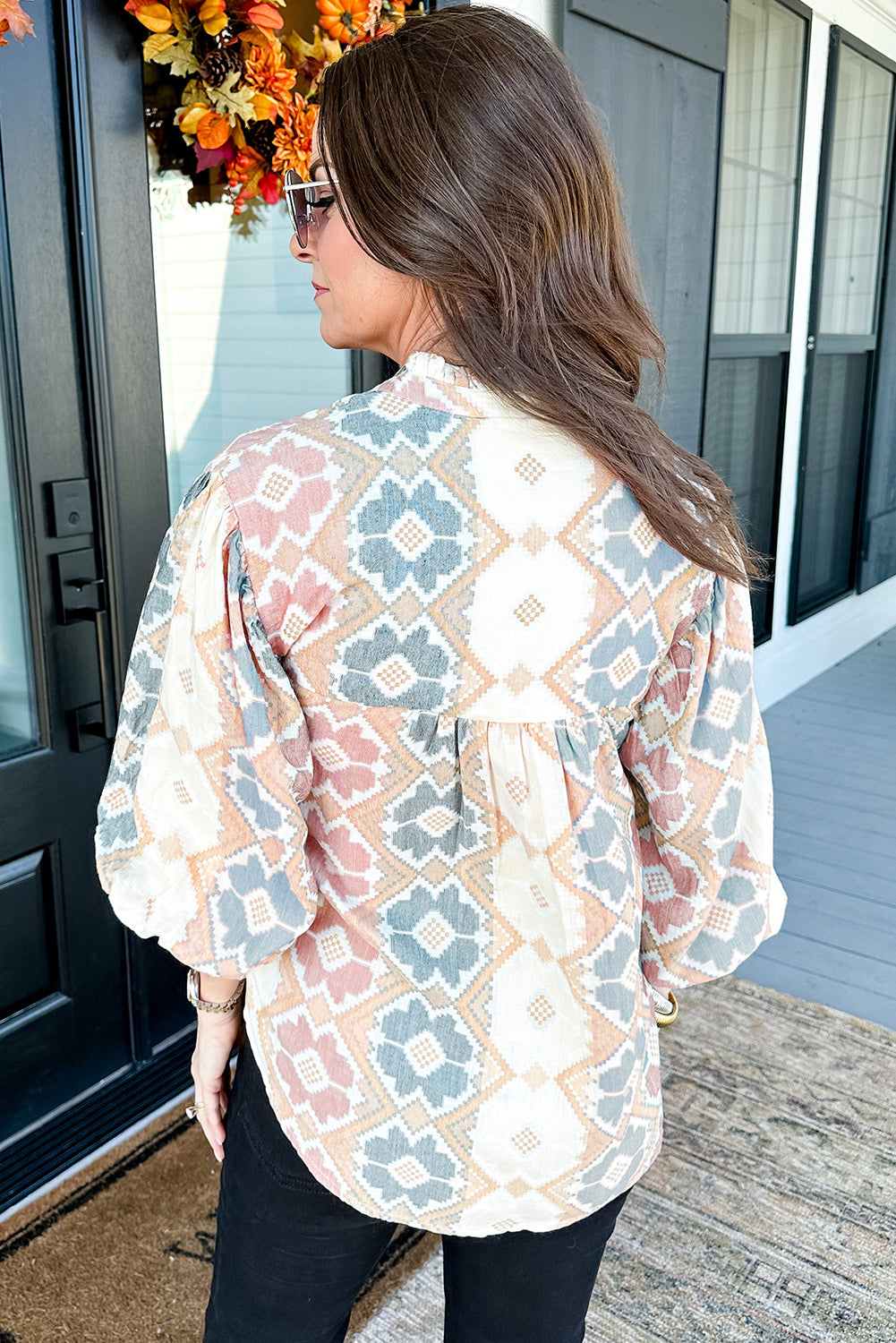 Khaki geometric print blouse by ModestAndDevoted with tassel tie, split neck, and balloon sleeves, made of polyester.