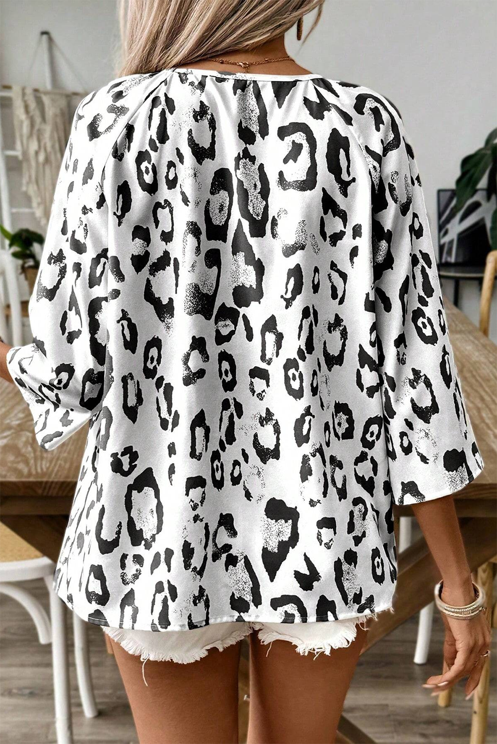 Khaki leopard print blouse by ModestAndDevoted with ruched V-neck, 3/4 sleeves, made of polyester, stylish and comfortable top.