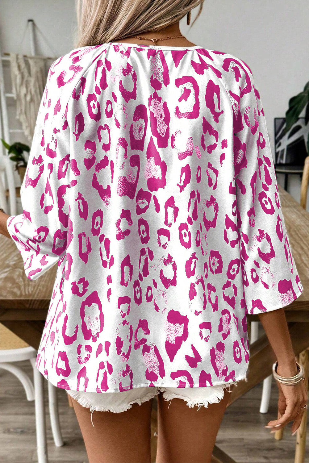 Khaki leopard print blouse by ModestAndDevoted with ruched V-neck and 3/4 sleeves, made of polyester, stylish and comfortable.