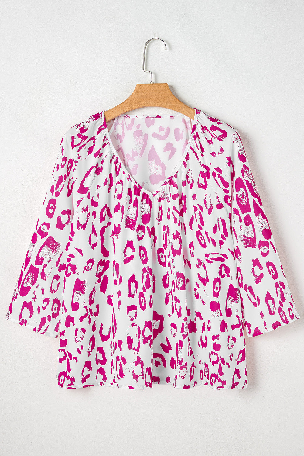 Khaki leopard print blouse with ruched V-neck and 3/4 sleeves, from ModestAndDevoted, made of polyester fabric.