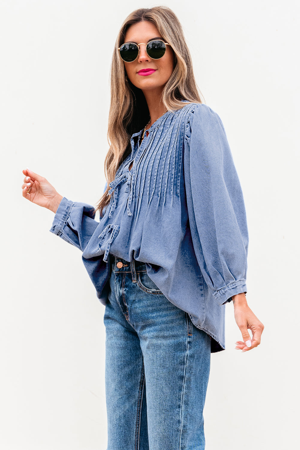 Myosotis denim puff sleeve top with front pintuck and bow tie detail, from ModestAndDevoted, made of cotton and polyester blend.