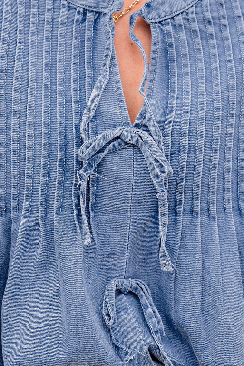 Myosotis denim puff sleeve blouse with front pintuck and bow tie detail, lightweight cotton-polyester blend, casual women’s top