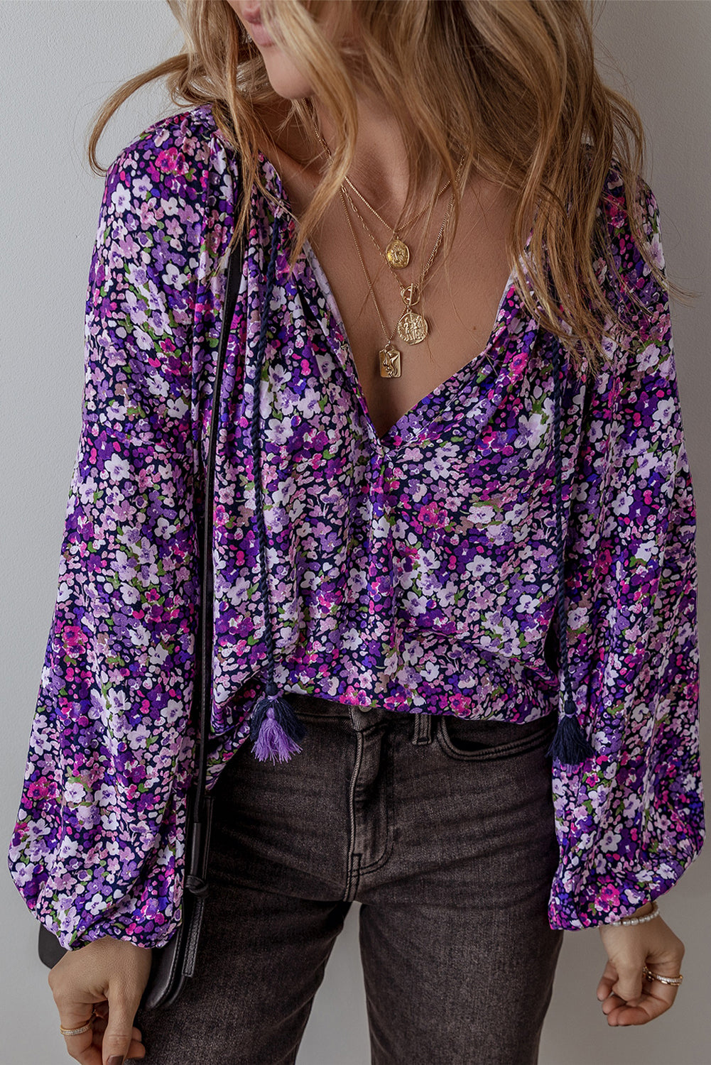 Purple boho flower split V-neck blouse with bubble sleeves from ModestAndDevoted, made of lightweight polyester, perfect for casual wear.