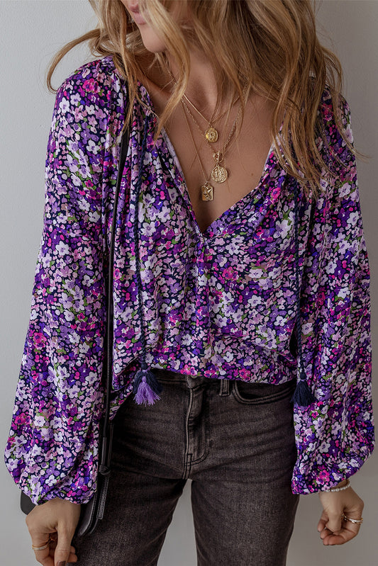 Purple boho flower split V-neck blouse with bubble sleeves from ModestAndDevoted, made of lightweight polyester, perfect for casual wear.