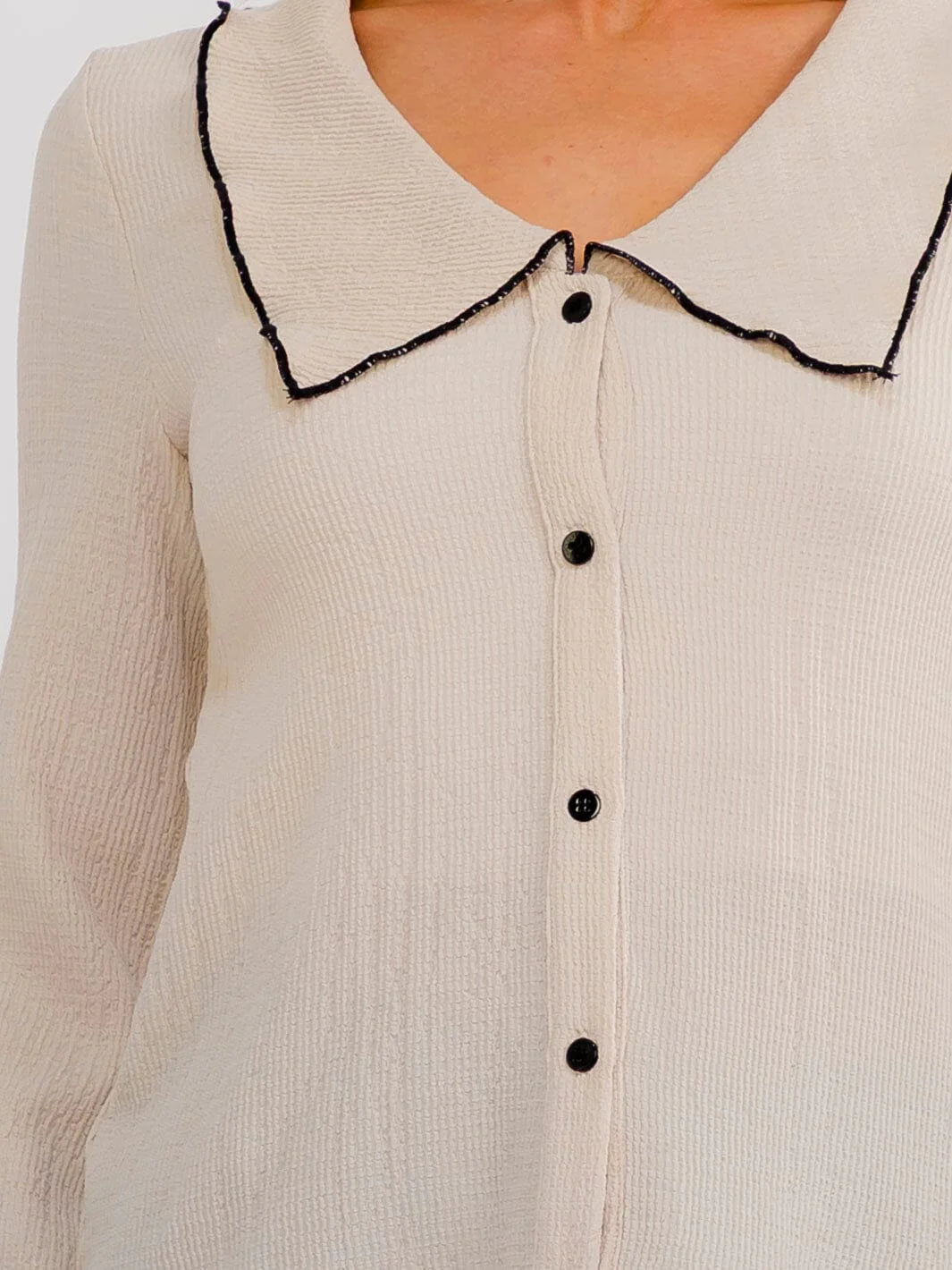 Beige women's long sleeve button-up blouse with trim collar, from ModestAndDevoted, featuring a classic shirt style for casual or office wear.