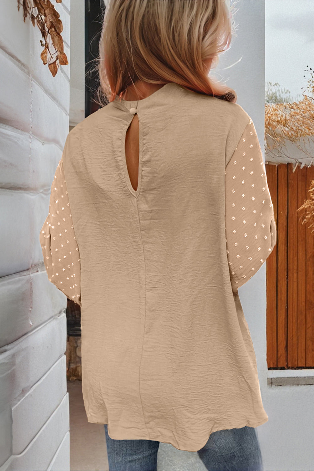 ModestAndDevoted Skobeloff Swiss Dot balloon sleeve loose blouse made of lightweight polyester, featuring a relaxed fit and elegant design.