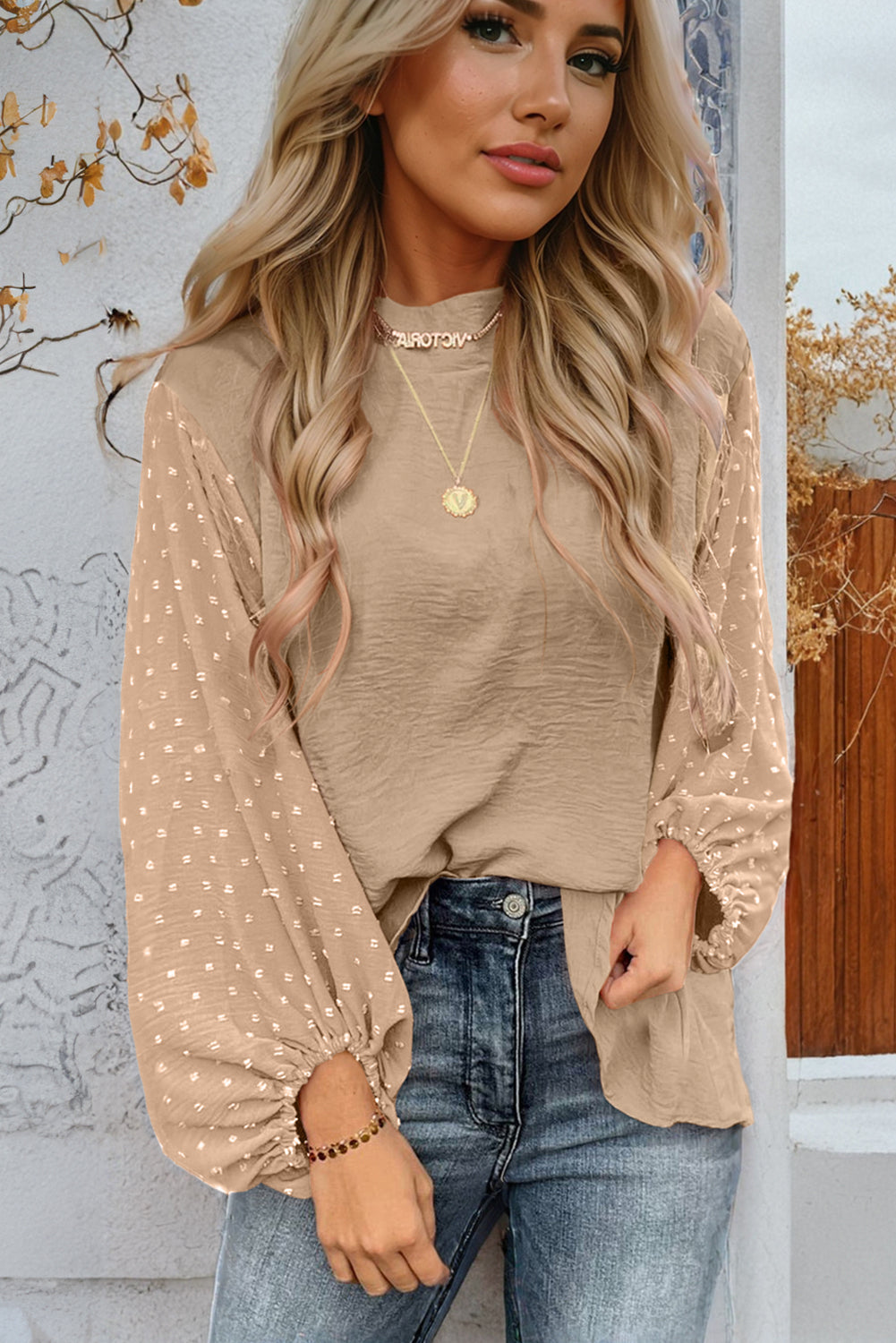 ModestAndDevoted Skobeloff Swiss Dot balloon sleeve loose blouse, lightweight polyester top with a relaxed fit and dotted pattern.