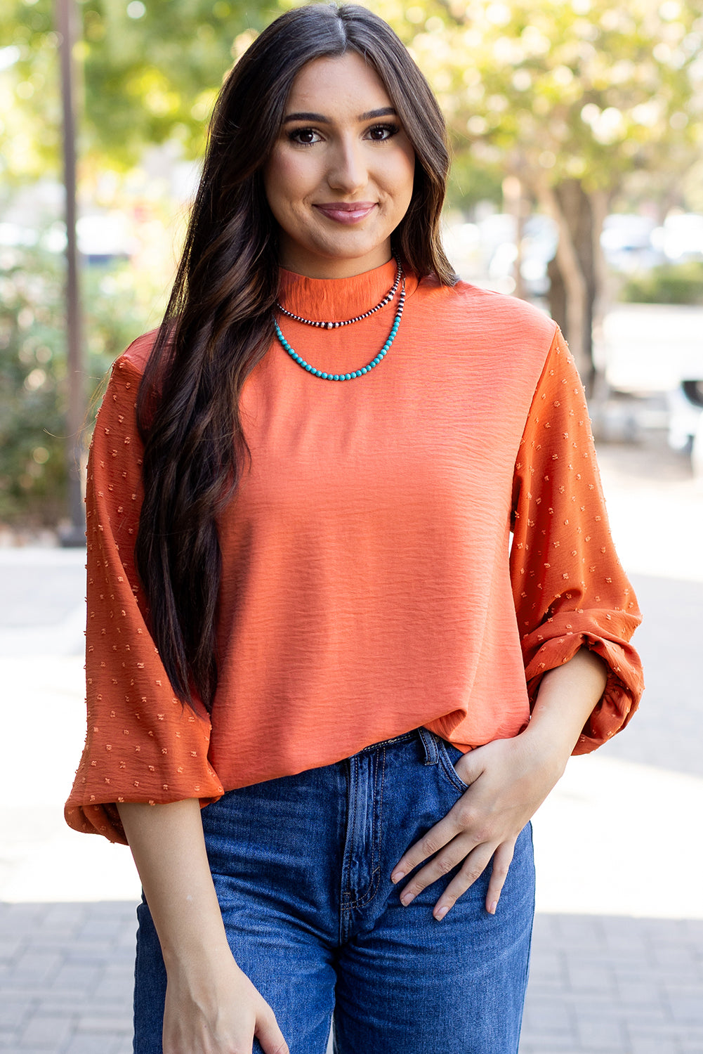 ModestAndDevoted Skobeloff Swiss Dot balloon sleeve loose blouse made of lightweight polyester, featuring a relaxed fit and elegant design.
