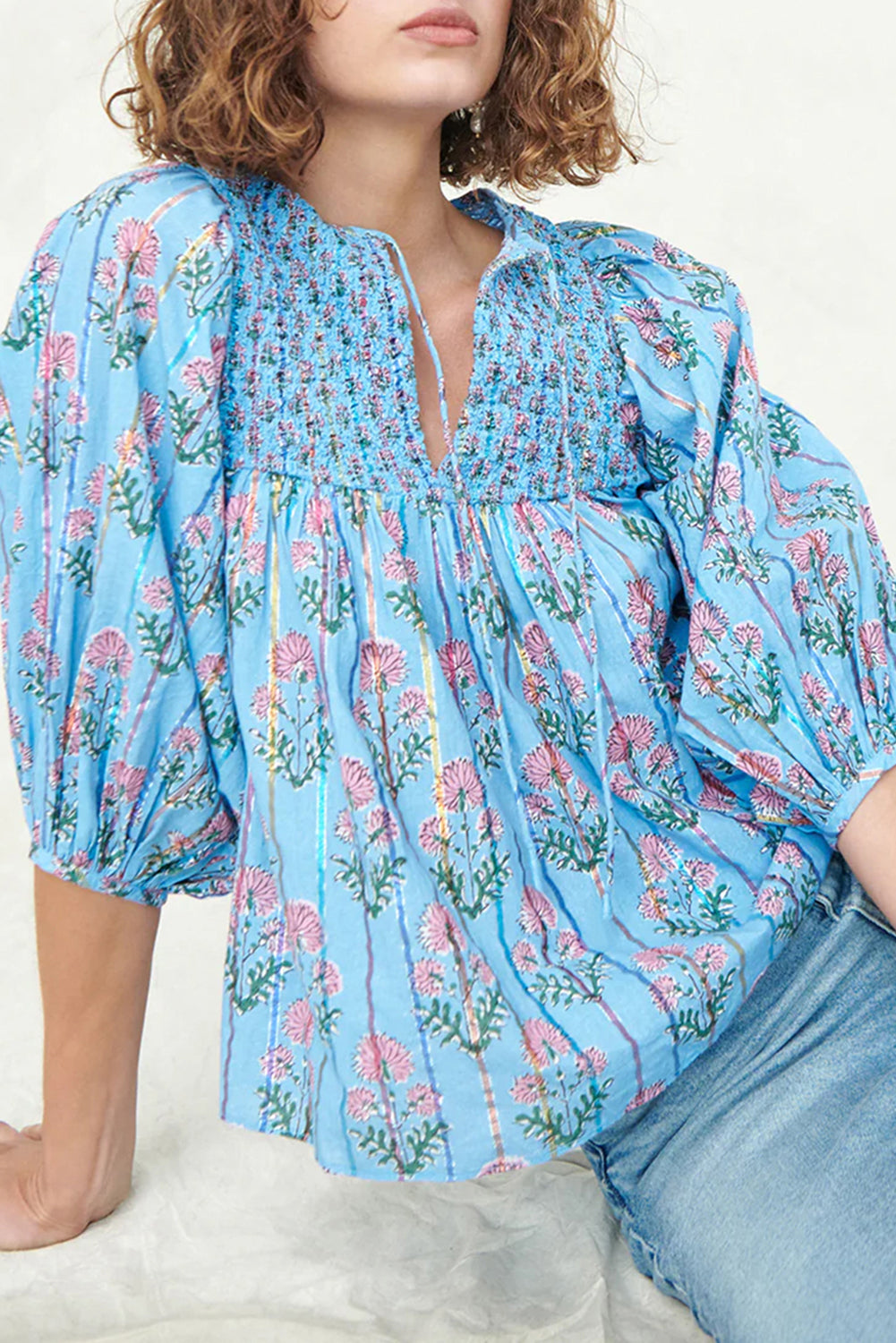 Sky blue floral striped print blouse with shirred yoke and split neck, made by ModestAndDevoted, featuring a lightweight cotton fabric.