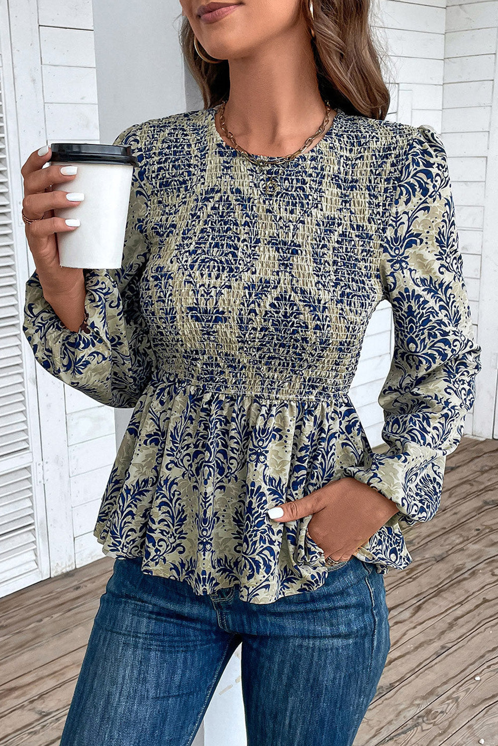 Sky blue boho printed blouse with balloon sleeves and smocked peplum, made of polyester, by ModestAndDevoted.