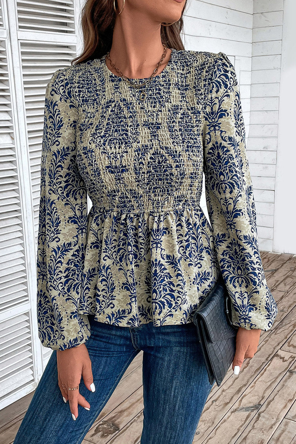 Sky blue boho printed balloon sleeve smocked peplum blouse from ModestAndDevoted, featuring a stylish relaxed fit and floral print.