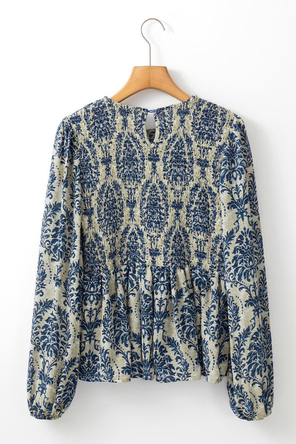 Sky blue boho printed balloon sleeve smocked peplum blouse by ModestAndDevoted, featuring a relaxed fit and stylish design.