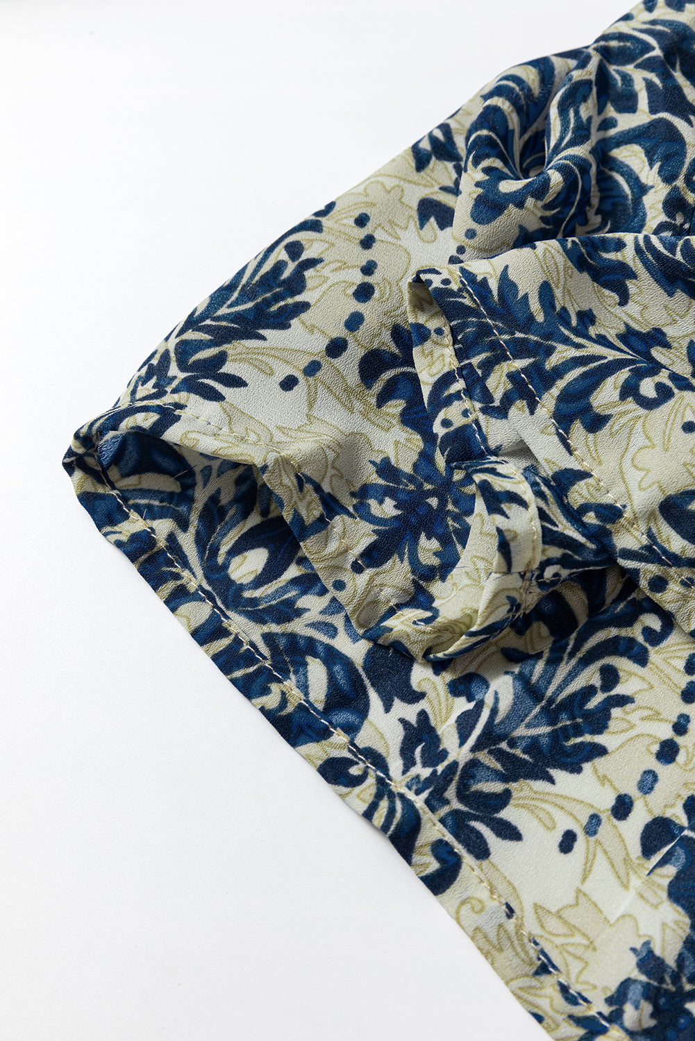 Sky blue boho printed balloon sleeve smocked peplum blouse by ModestAndDevoted, featuring a stylish and comfortable design.