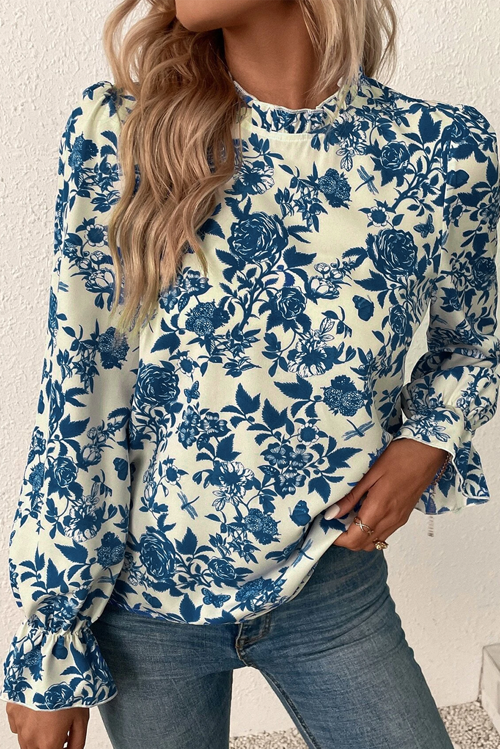 Sky blue floral print blouse with flounce sleeves and keyhole back, from ModestAndDevoted, stylish and lightweight polyester top.
