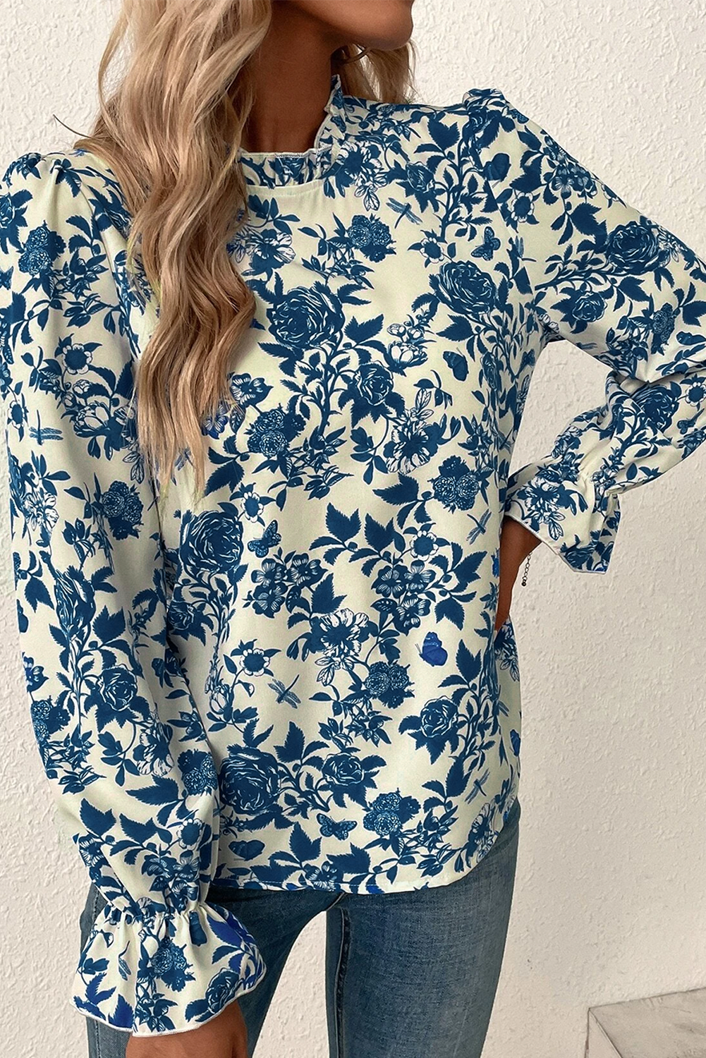 Sky blue floral print blouse with flounce sleeves and keyhole back, made by ModestAndDevoted, perfect for casual or semi-formal wear.