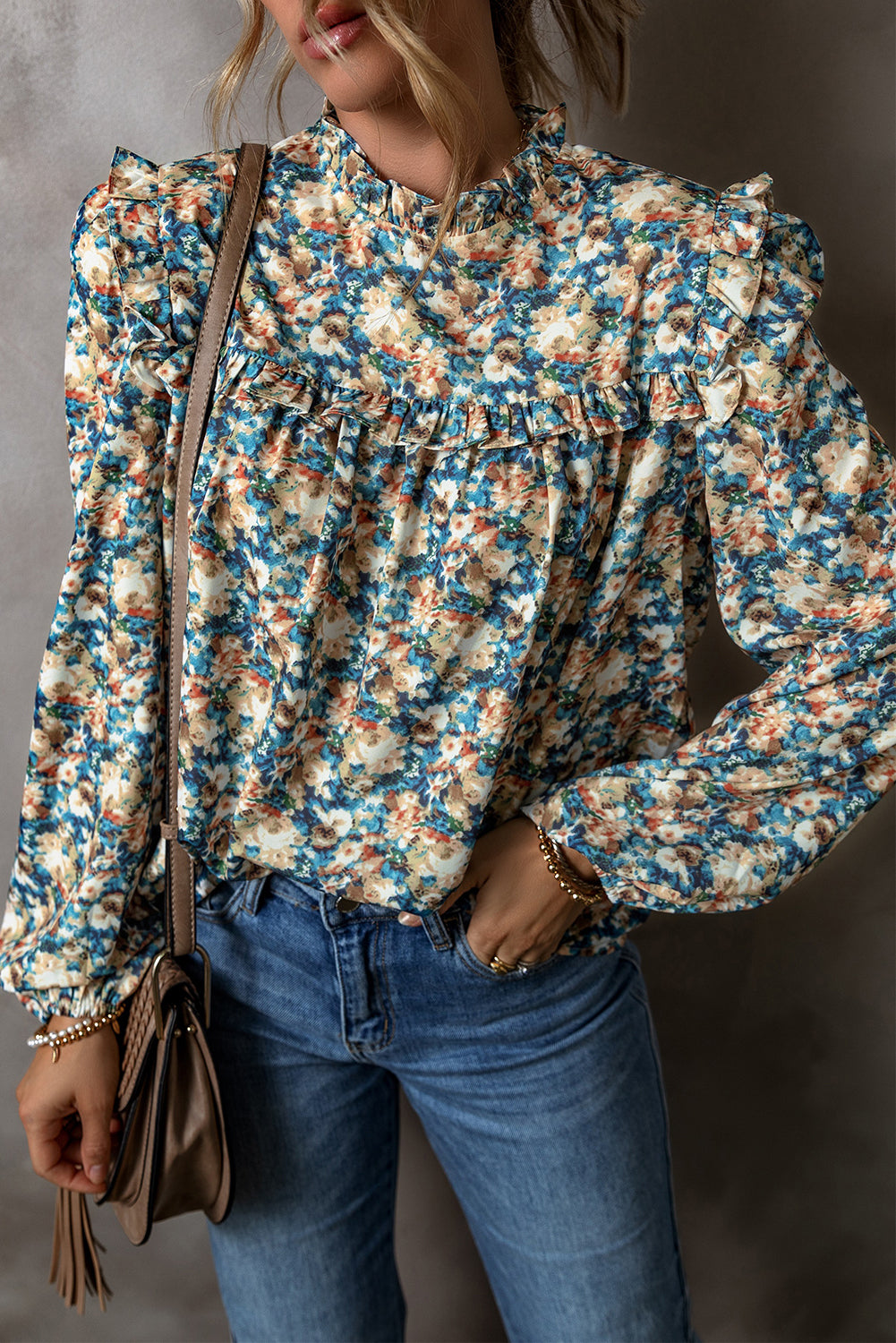 Sky blue floral print blouse with frilled mock neck and puff sleeves from ModestAndDevoted, made of polyester fabric.