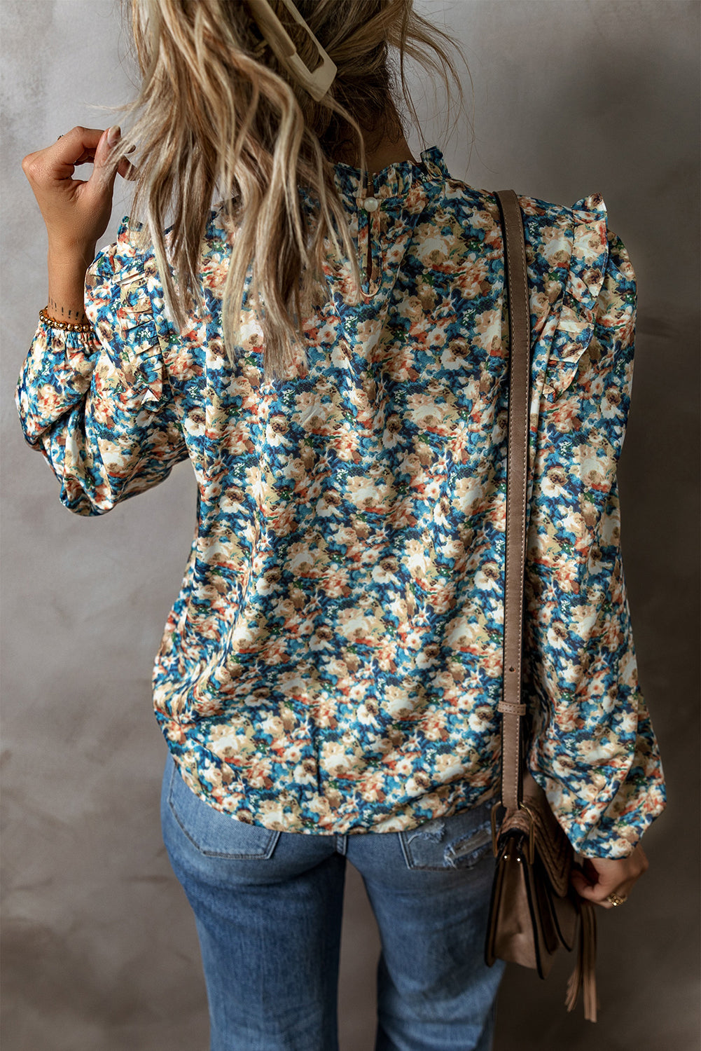 Sky blue floral print blouse with frilled mock neck and puff sleeves, from ModestAndDevoted, made of polyester.