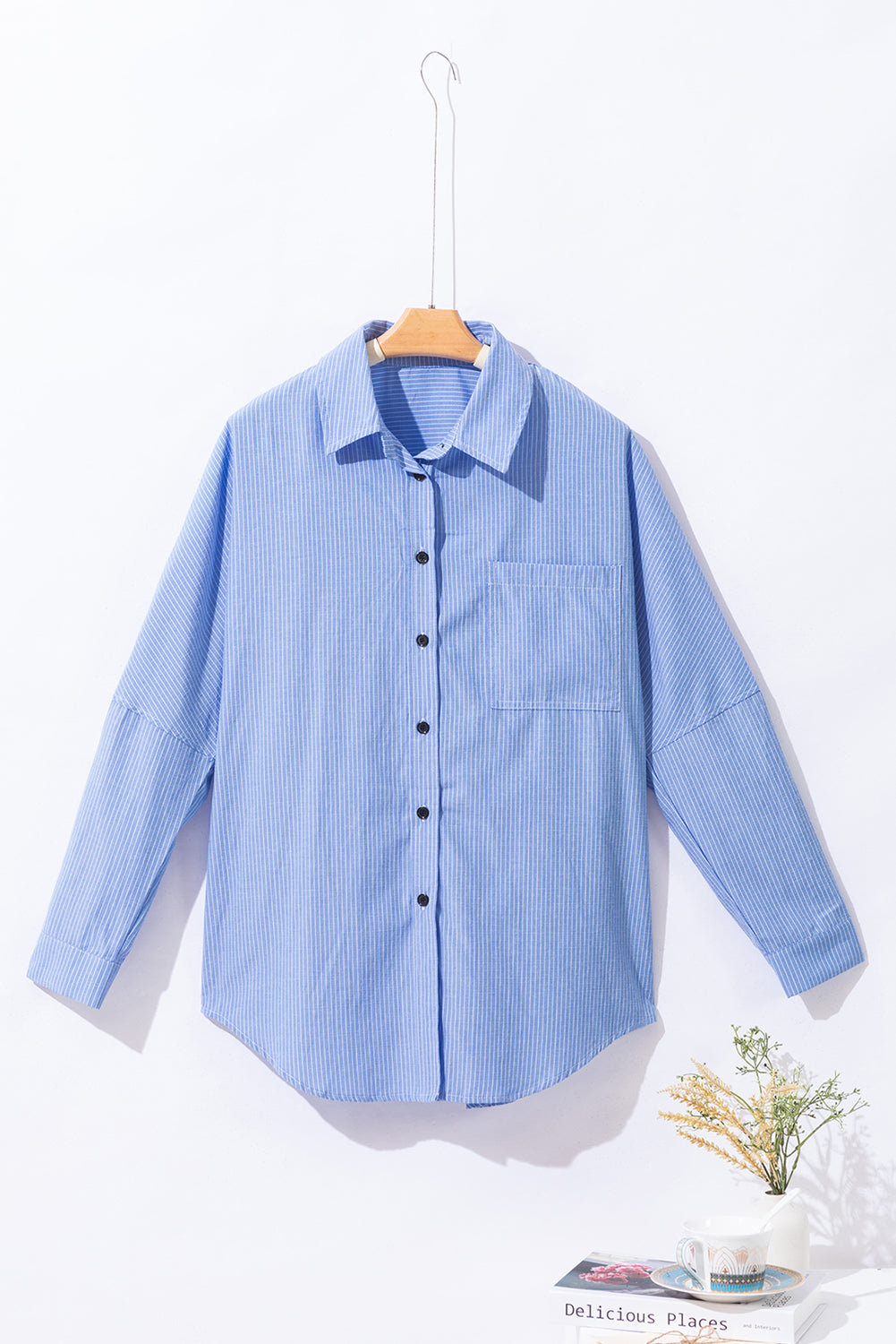 Sky blue stripe long shirt with roll-tab sleeves and front pockets by ModestAndDevoted, made of polyester and cotton blend.