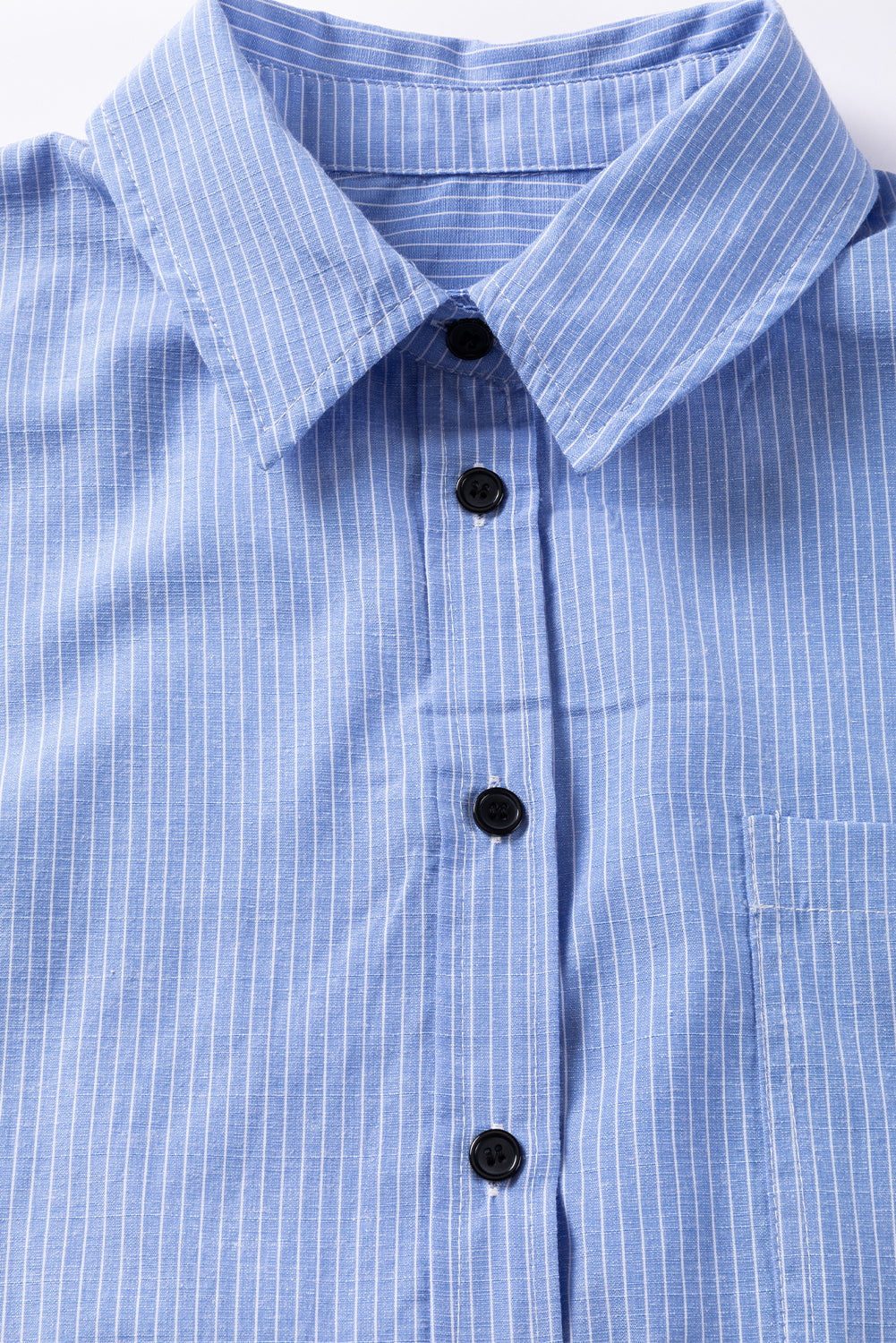Sky blue stripe long shirt with roll-tab sleeves and chest pocket, made by ModestAndDevoted, ideal for casual or office wear.