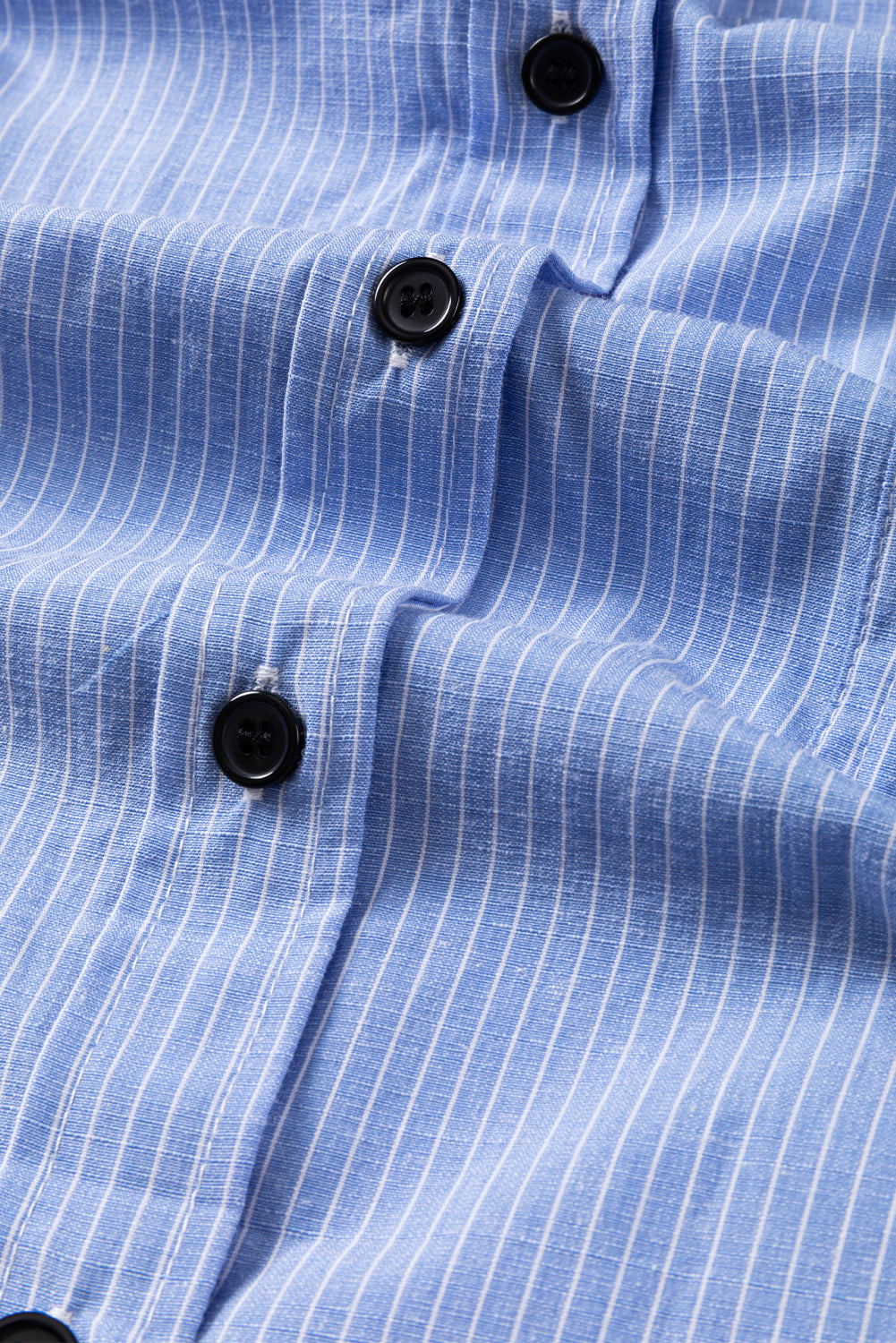 Sky blue stripe long shirt by ModestAndDevoted with roll-tab sleeves and chest pockets, made of polyester and cotton.