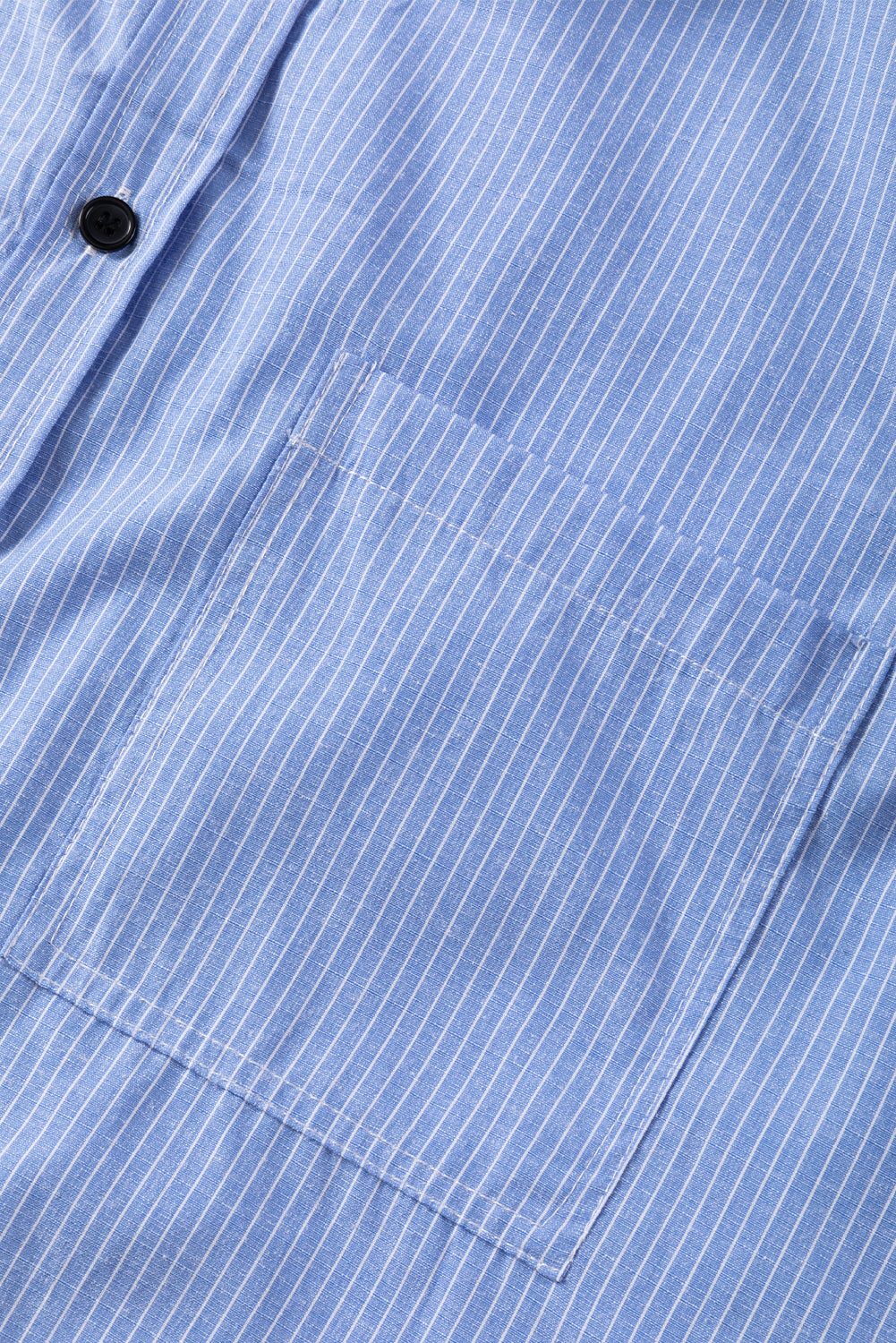 Sky blue striped long shirt with roll-tab sleeves and chest pockets, made of polyester and cotton, from ModestAndDevoted.