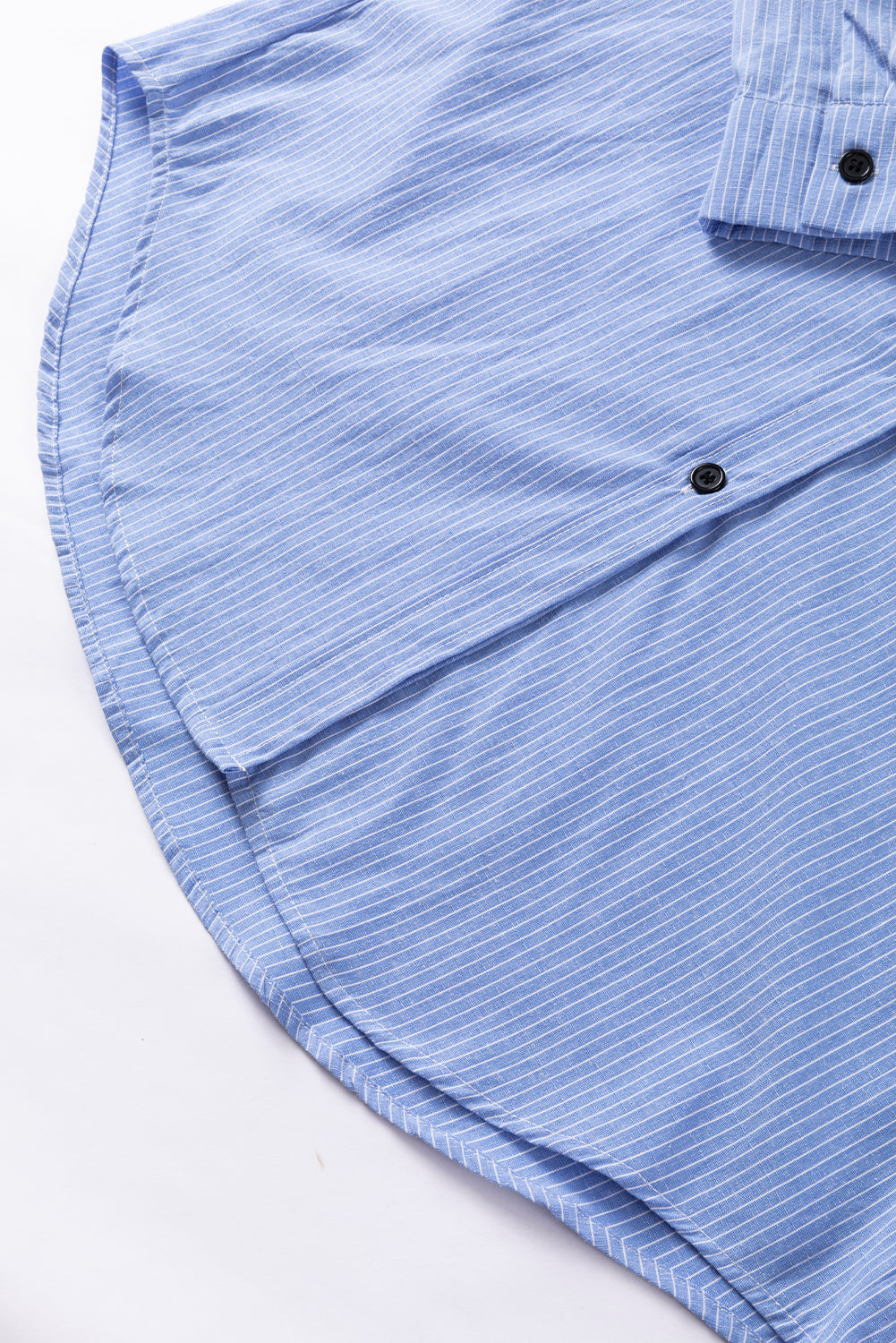 Sky blue stripe long shirt with roll-tab sleeves and chest pockets by ModestAndDevoted, made of polyester and cotton blend.