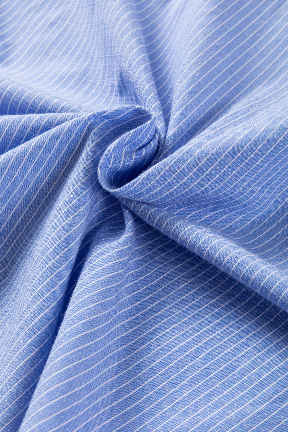 Sky blue stripe long shirt with roll-tab sleeves and chest pockets by ModestAndDevoted, made of polyester and cotton blend.