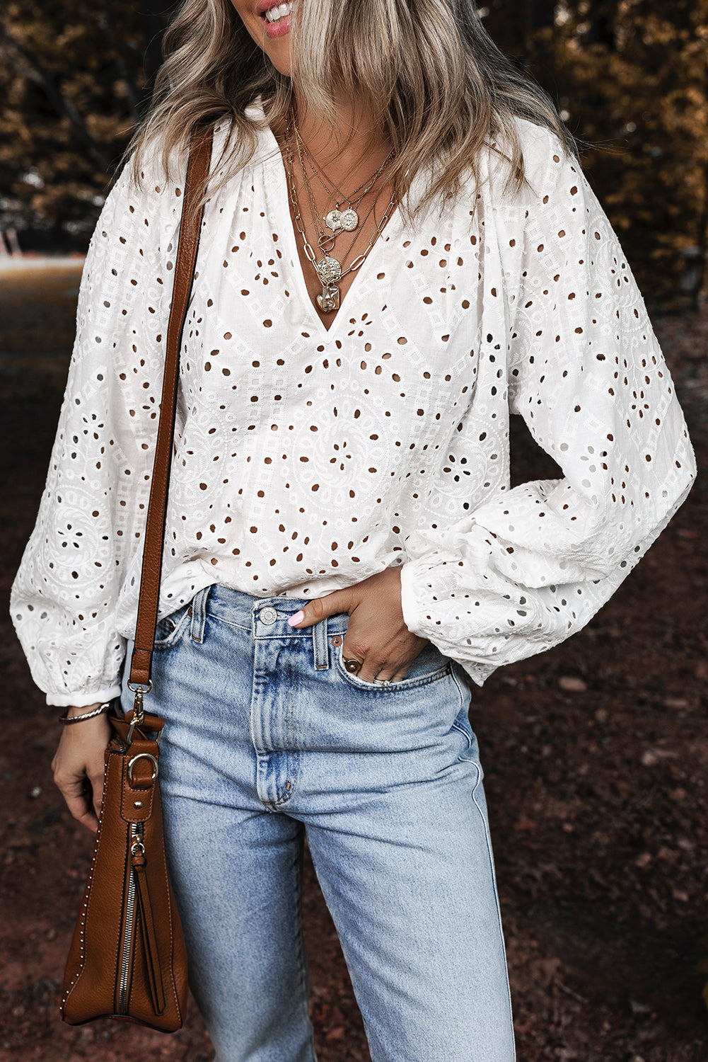 White eyelet embroidered puff sleeve V-neck blouse from ModestAndDevoted, featuring cotton fabric and feminine detailing.
