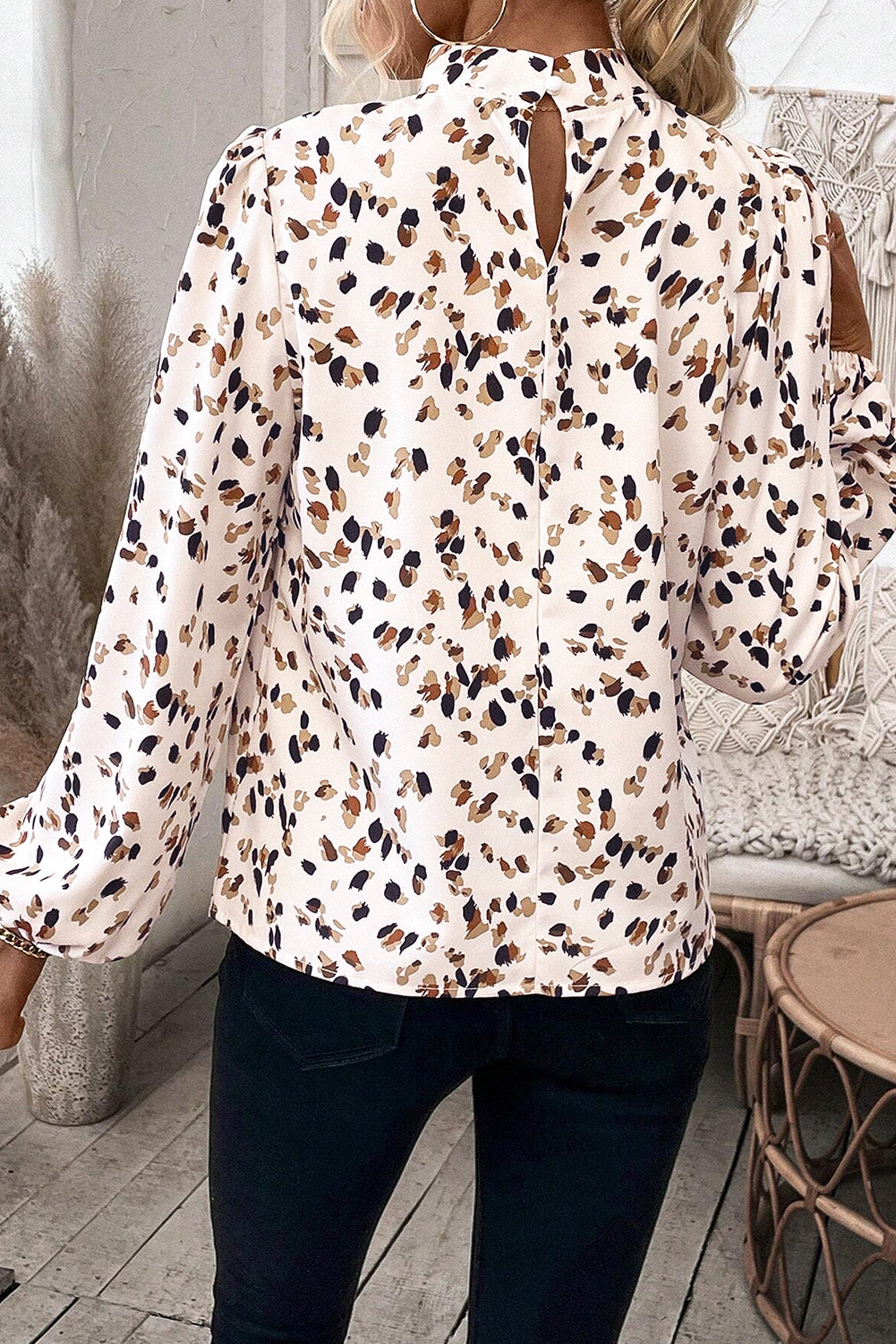 White leopard print lantern sleeve mock neck blouse with pleats from ModestAndDevoted, featuring a stylish, fitted design.