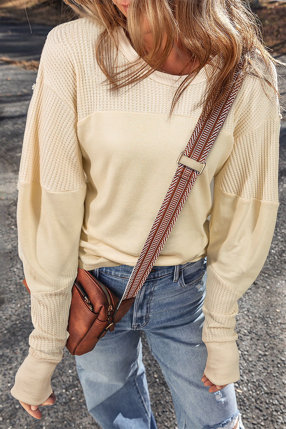 Beige thermal knit patchwork long sleeve top by ModestAndDevoted, featuring exposed seams and a cozy, casual style.