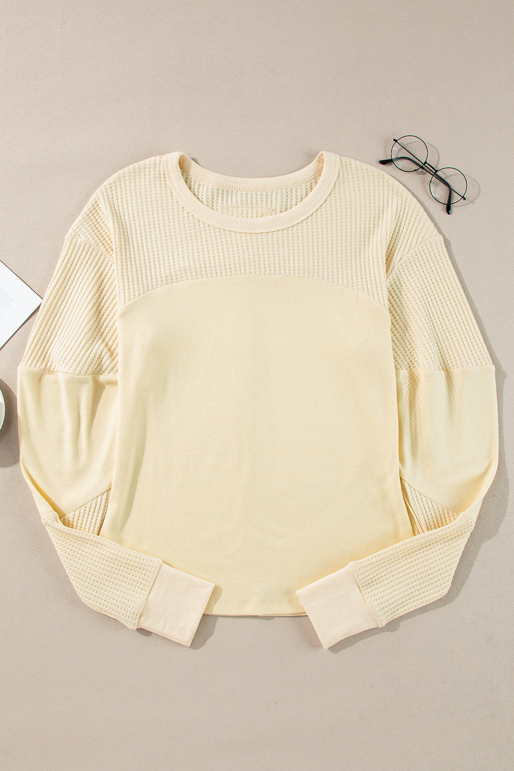 Beige thermal knit patchwork long sleeve top by ModestAndDevoted with exposed seams, cotton-polyester-elastane blend, casual style.