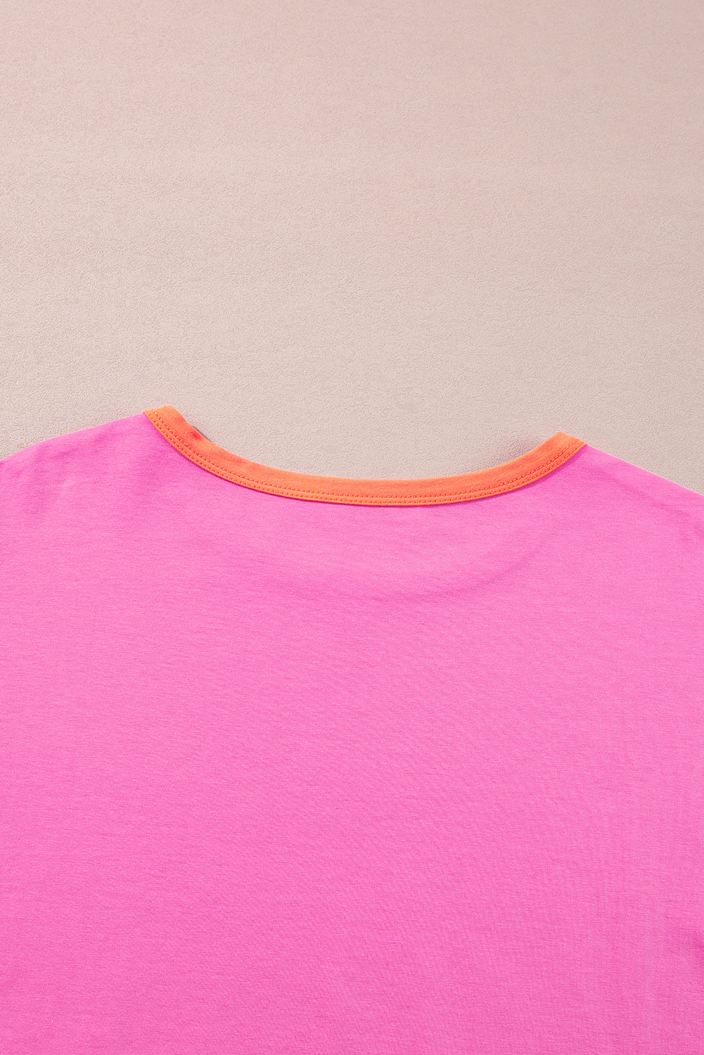 Dark blue colorblock patchwork long sleeve loose top by ModestAndDevoted, made of cotton and elastane, shown on a hanger.