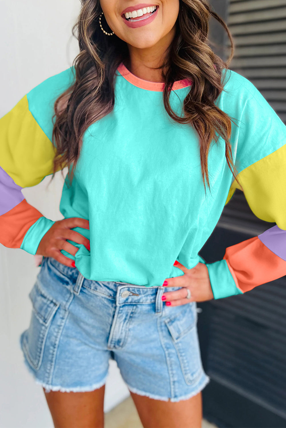 Dark blue colorblock patchwork long sleeve loose top from ModestAndDevoted, showing a relaxed fit with contrasting patchwork details.