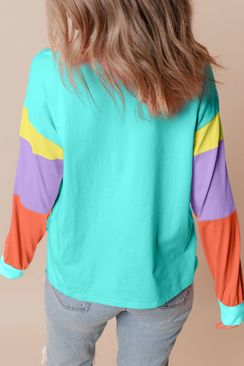 Dark blue colorblock patchwork long sleeve loose top by ModestAndDevoted, showing its relaxed fit and stylish design.