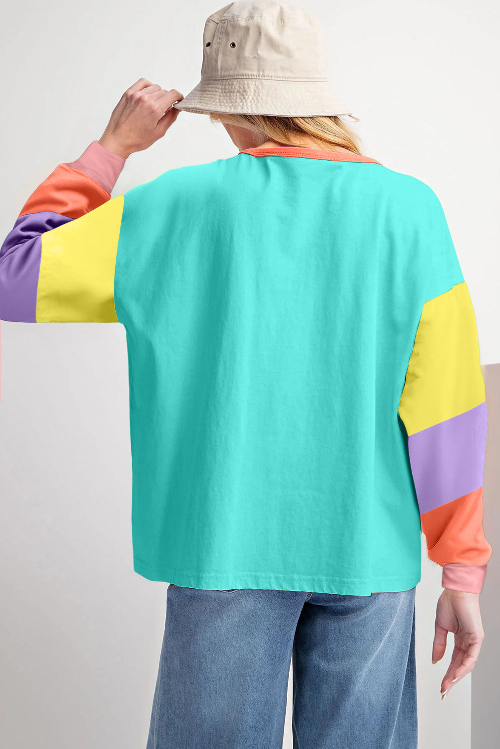 Dark blue colorblock patchwork long sleeve loose top by ModestAndDevoted, featuring a casual fit and contrasting fabric panels.