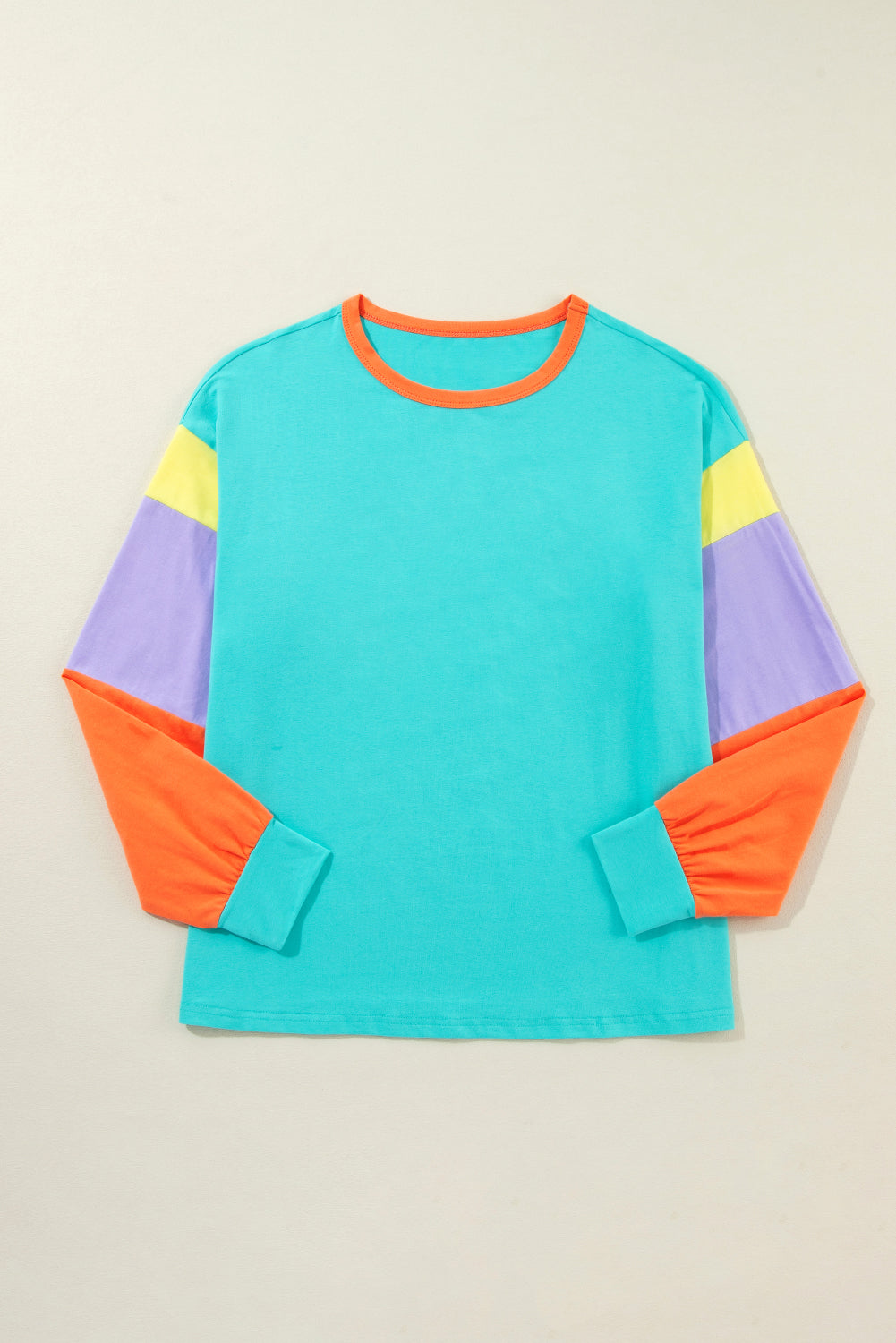 Dark blue colorblock patchwork long sleeve top by ModestAndDevoted, loose fit with long sleeves and stylish design.