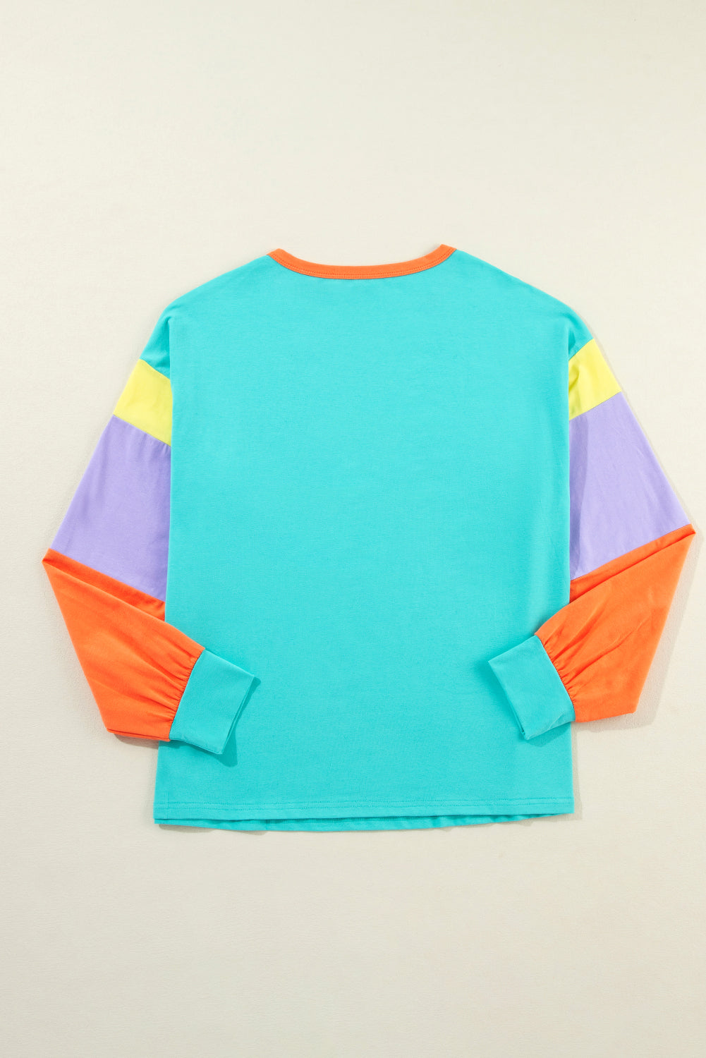 Dark blue colorblock patchwork long sleeve loose top by ModestAndDevoted, featuring a casual, comfortable fit with contrasting fabric panels.