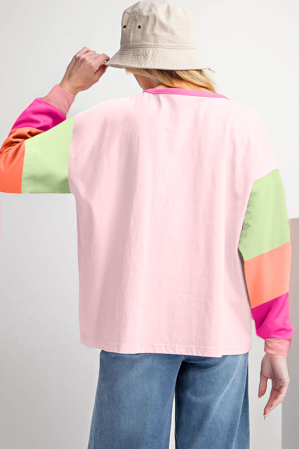 Dark blue colorblock patchwork long sleeve loose top by ModestAndDevoted, featuring a relaxed fit and contrasting fabric patches.