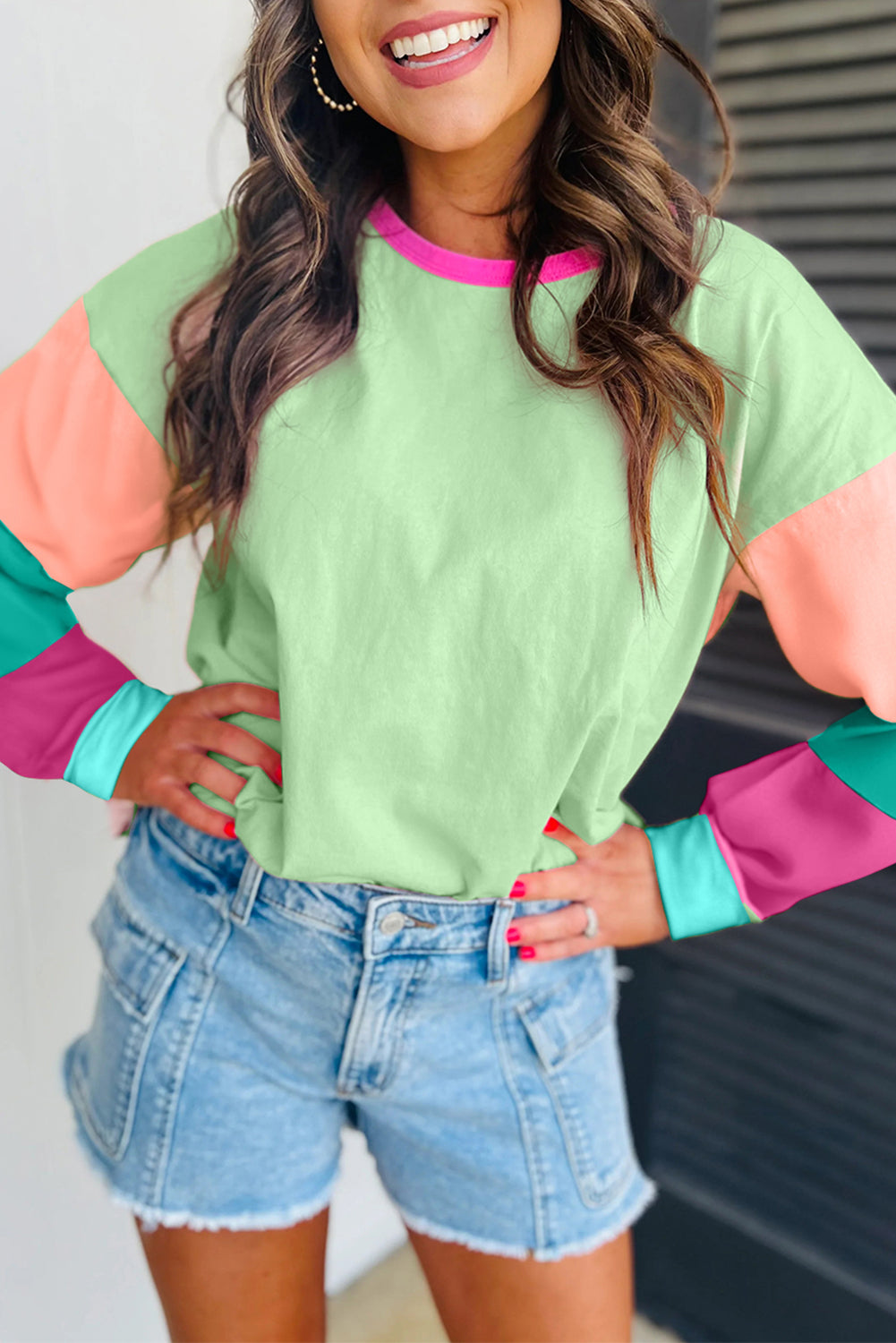 Dark blue colorblock patchwork long sleeve loose top by ModestAndDevoted, featuring a relaxed fit and contrasting fabric panels.
