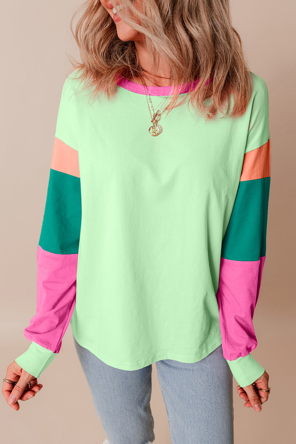 Dark blue colorblock patchwork long sleeve loose top by ModestAndDevoted, featuring a casual, relaxed fit with contrasting fabric patches.