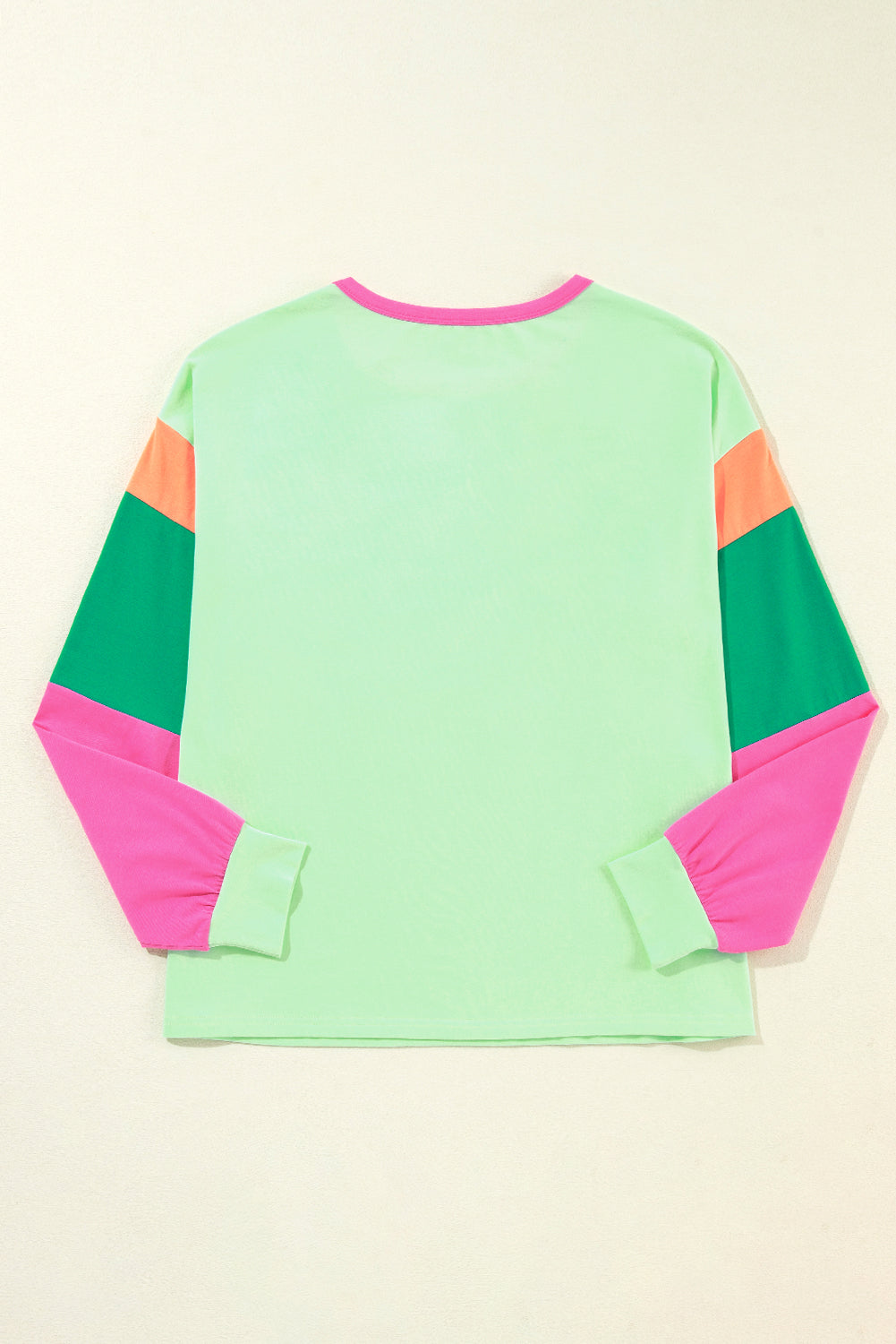 Dark blue colorblock patchwork long sleeve loose top by ModestAndDevoted, featuring a casual, relaxed fit with contrasting fabric panels.