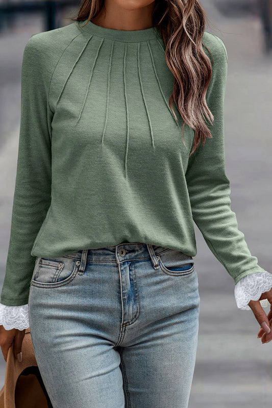 Grass green long sleeve raglan top by ModestAndDevoted with seam detail, lace contrast cuffs, and comfortable fabric blend.