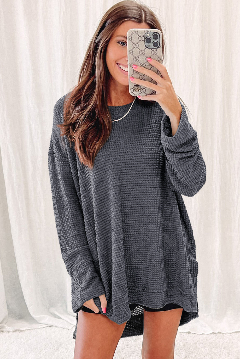 Gray waffle knit oversized top with high slits, long sleeves, from ModestAndDevoted, made of polyester and elastane.