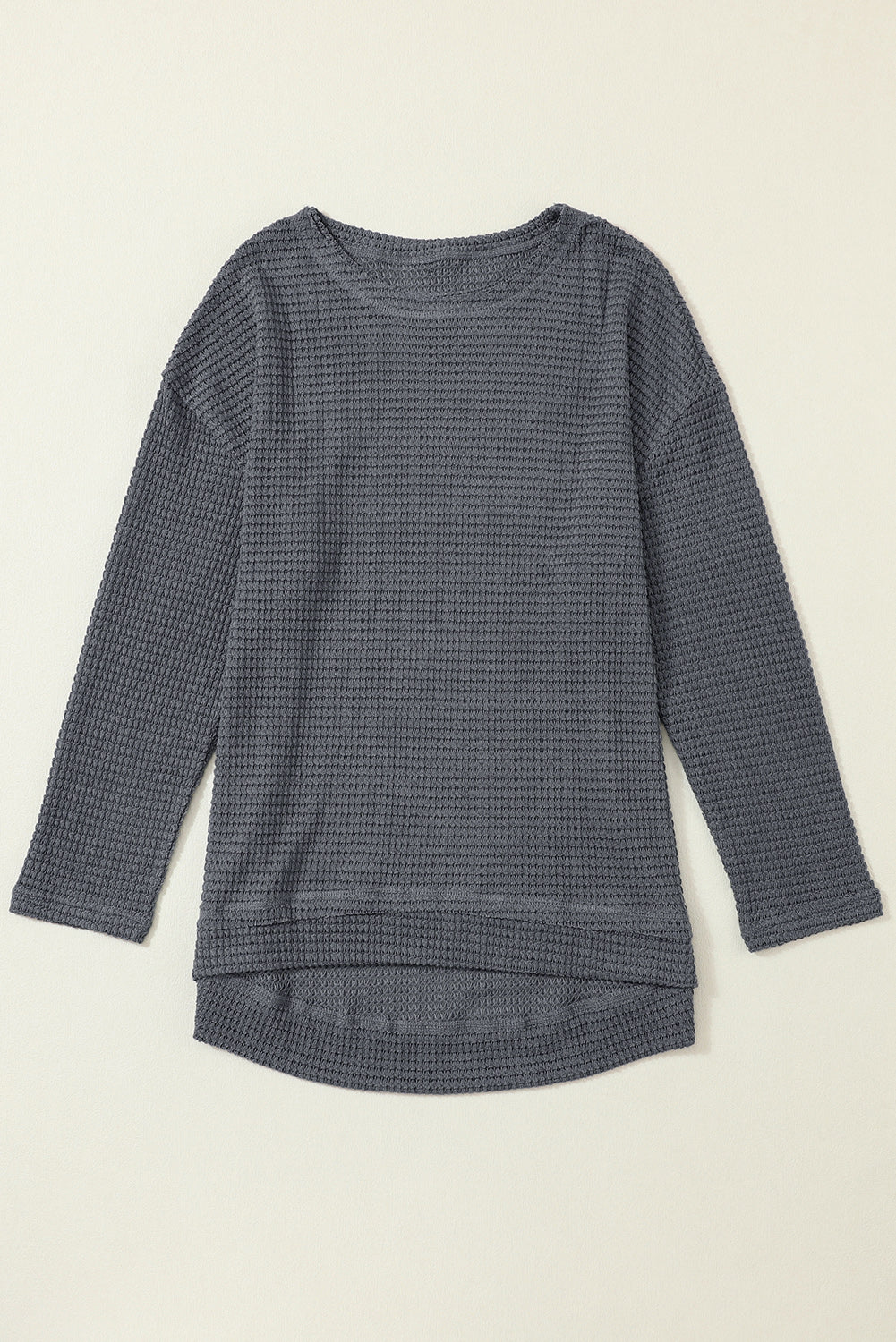 Gray waffle knit oversized top with high slits, long sleeve design from ModestAndDevoted, made of polyester and elastane.