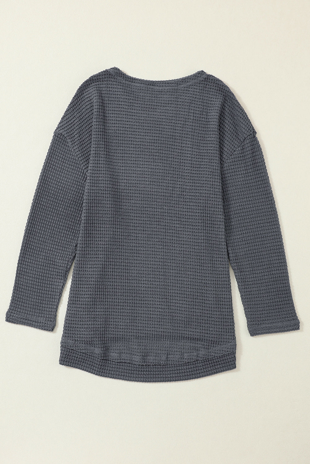 Gray waffle knit oversized long sleeve top with high slits from ModestAndDevoted, made of polyester and elastane.