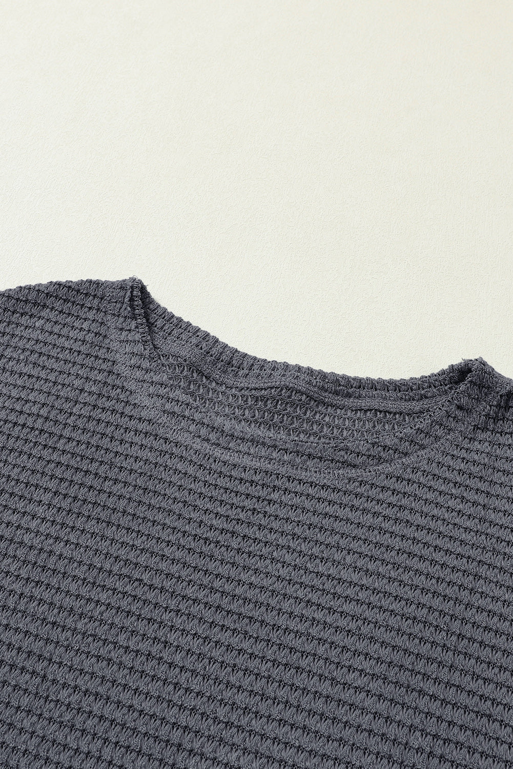 Gray waffle knit oversized long sleeve top with high slits from ModestAndDevoted, featuring a relaxed fit and textured fabric.