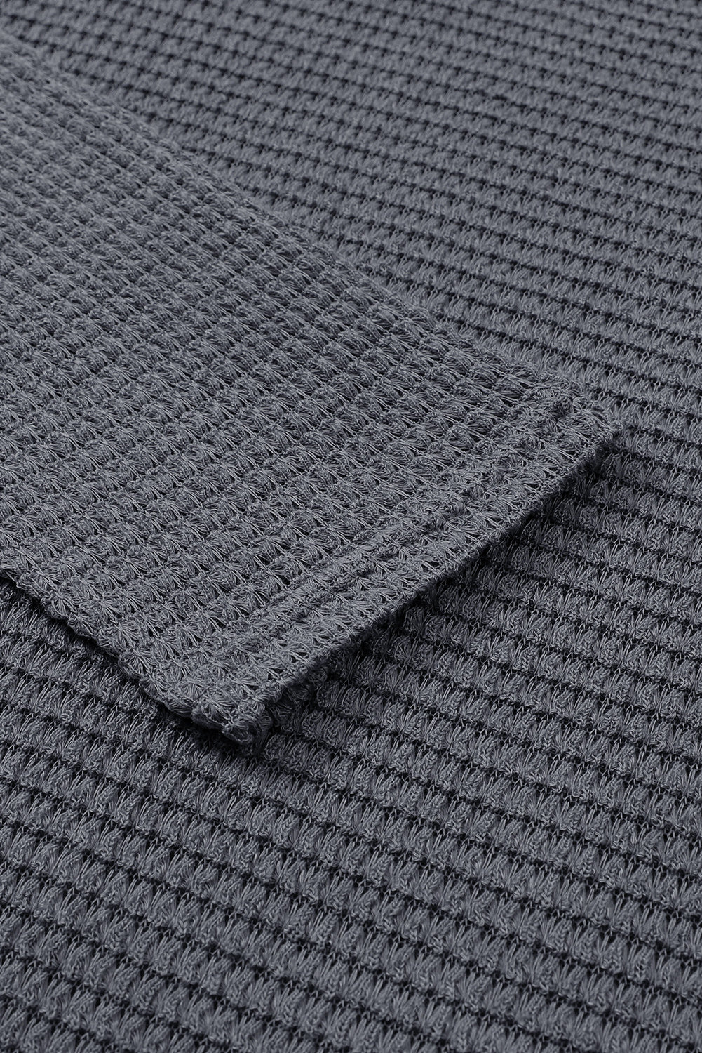 Gray waffle knit oversized top with high slits from ModestAndDevoted, long sleeve design, soft polyester and elastane fabric.