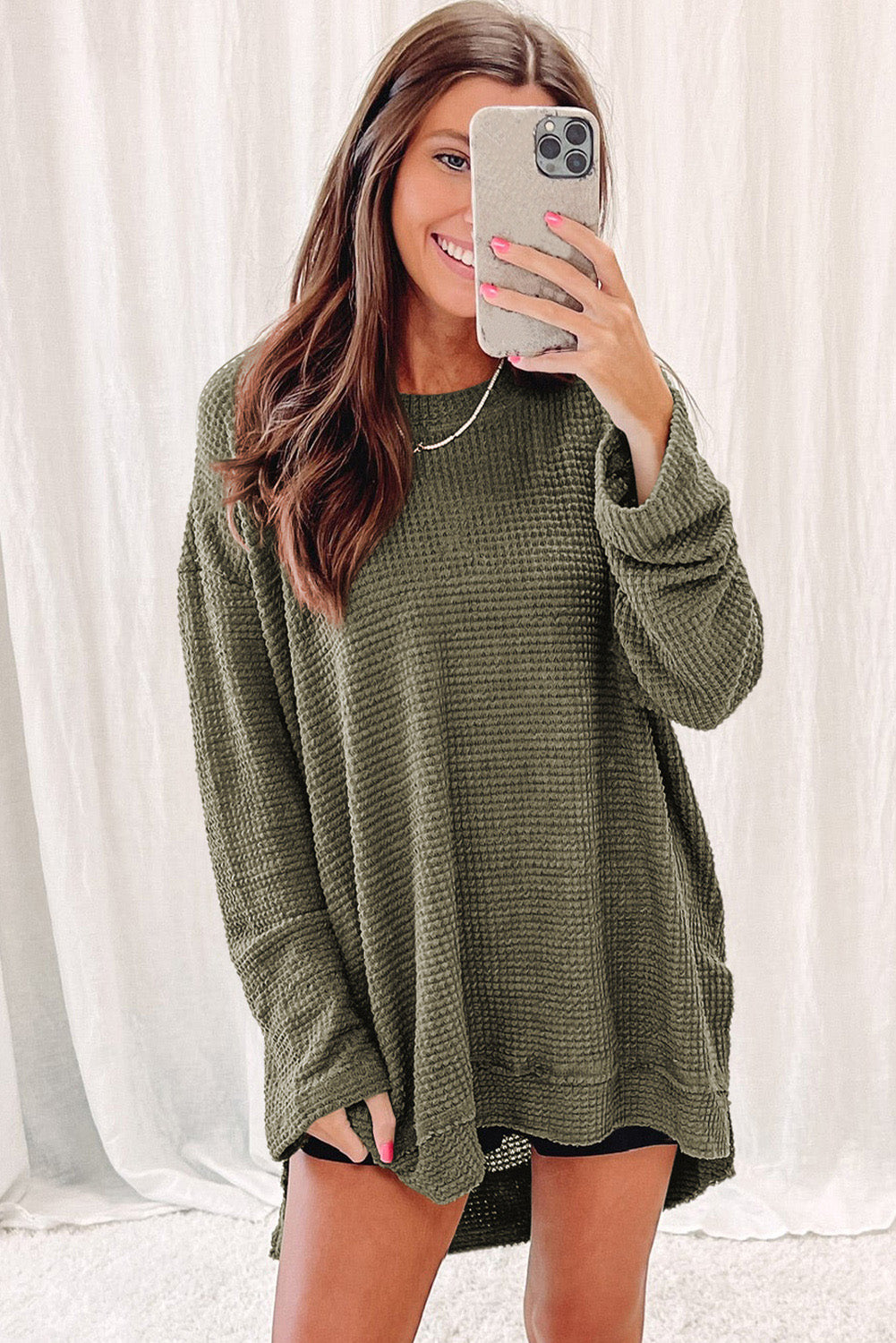 Green waffle knit oversized top with high slits, long sleeves, and relaxed fit from ModestAndDevoted.