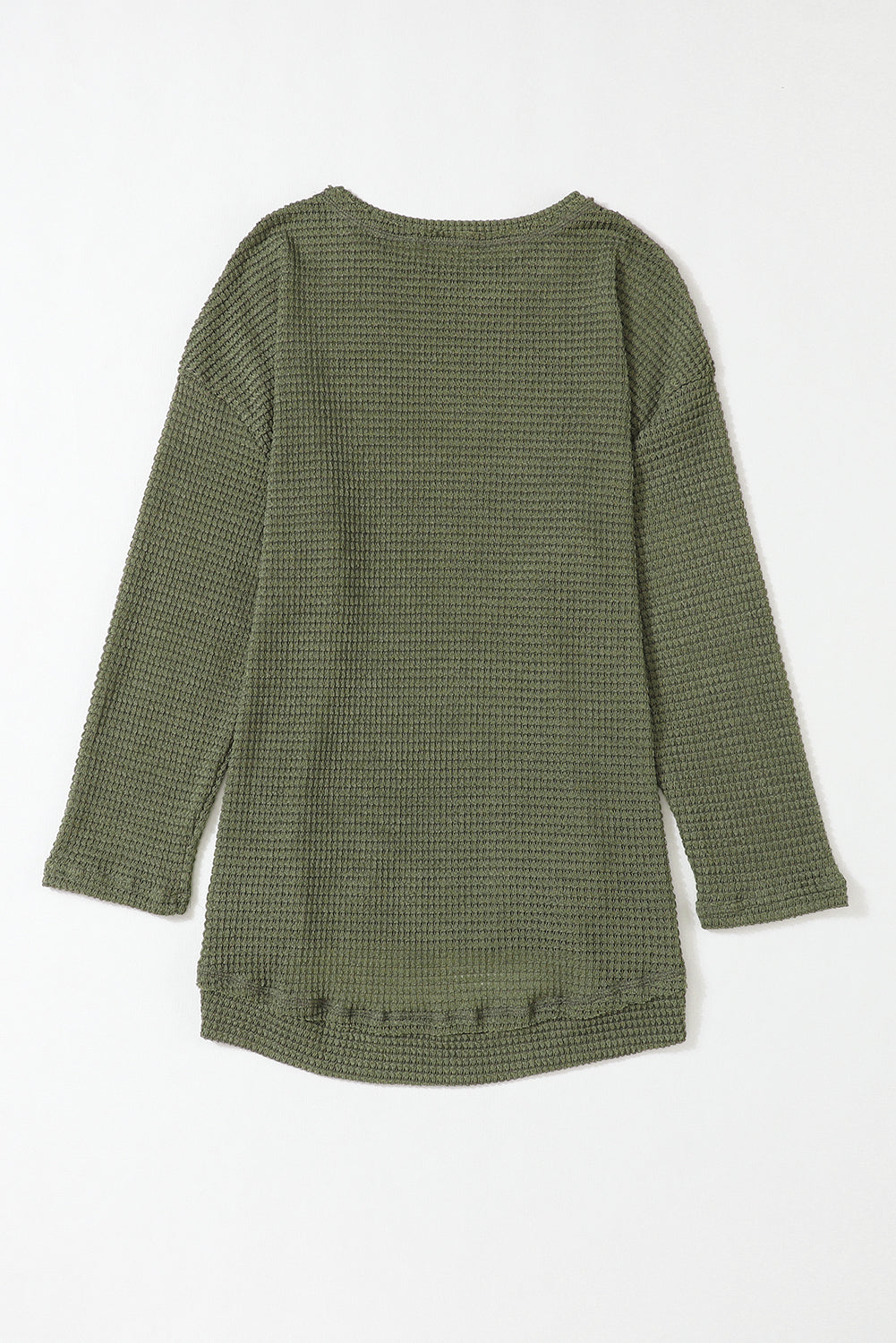 Green waffle knit oversized long sleeve top with high slits from ModestAndDevoted, featuring a relaxed fit and textured fabric.