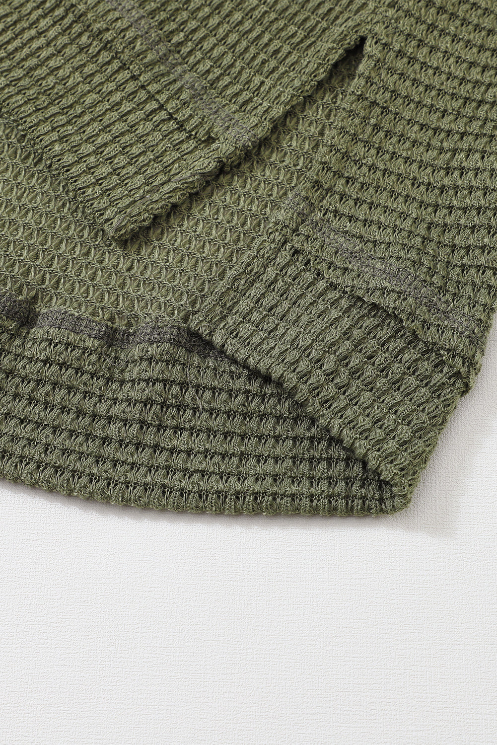Green waffle knit oversized long sleeve top with high slits from ModestAndDevoted, featuring a relaxed, cozy fit.